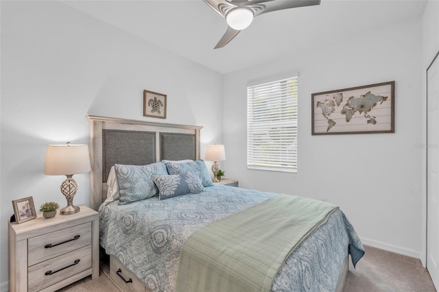 carpeted bedroom featuring ceiling fan