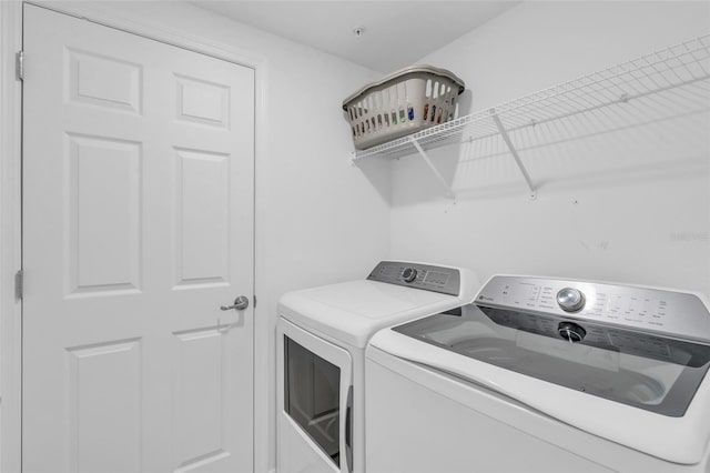 laundry room with independent washer and dryer