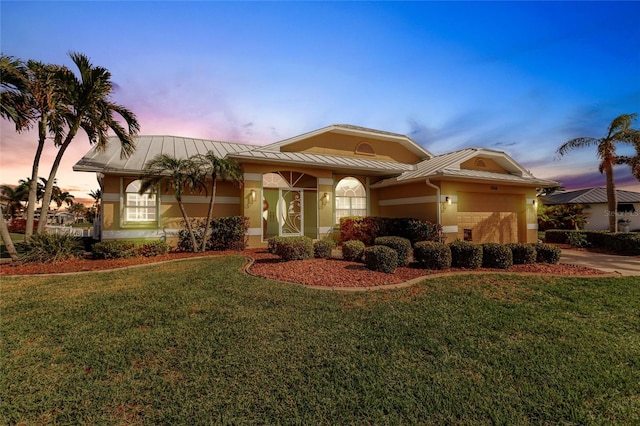 view of front of property with a lawn