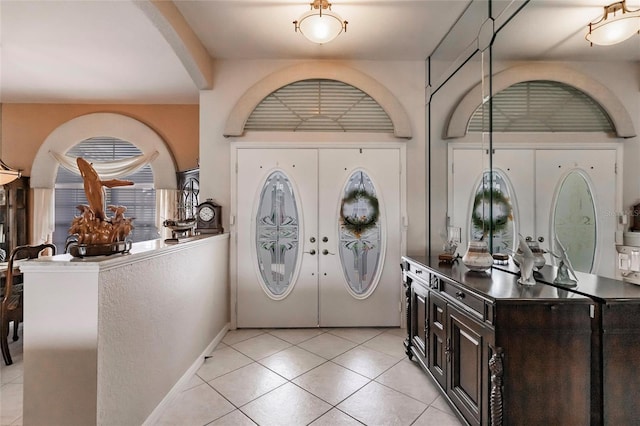 2868 Coral Way, Punta Gorda, FL 33950 - foyer featuring light tile patterned flooring, baseboards, and french doors