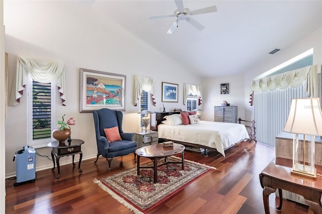 bedroom with dark wood-type flooring, lofted ceiling, and ceiling fan