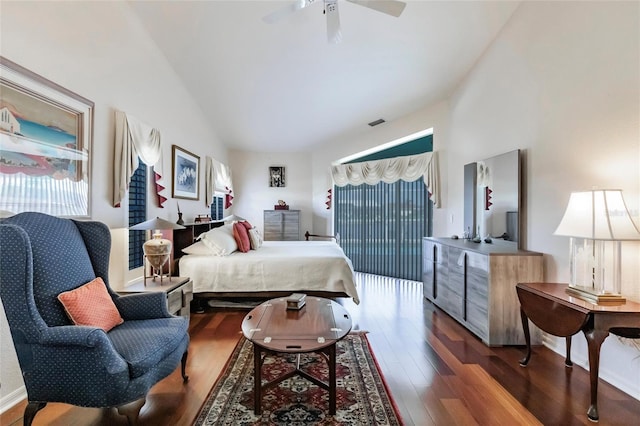 bedroom with dark wood-type flooring, ceiling fan, and vaulted ceiling