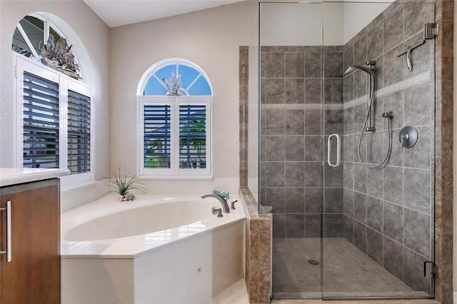 bathroom featuring lofted ceiling and plus walk in shower