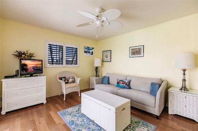 living room featuring ceiling fan and wood-type flooring