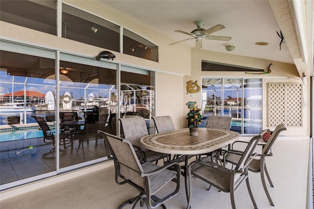 interior space with ceiling fan