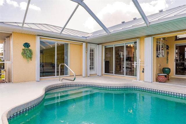 view of pool featuring a patio area and a lanai