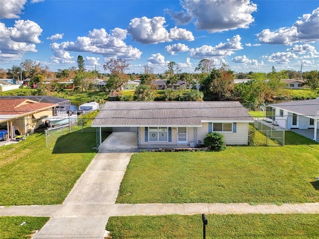 view of front facade featuring a front lawn and a carport