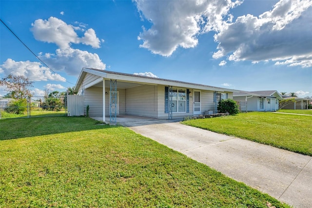 ranch-style house with a front lawn and a carport