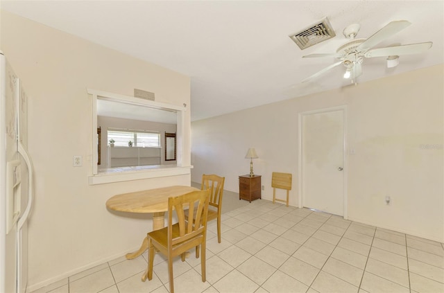 dining room featuring light tile patterned floors and ceiling fan