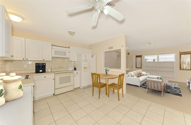 kitchen with decorative backsplash, white cabinetry, ceiling fan, and white appliances