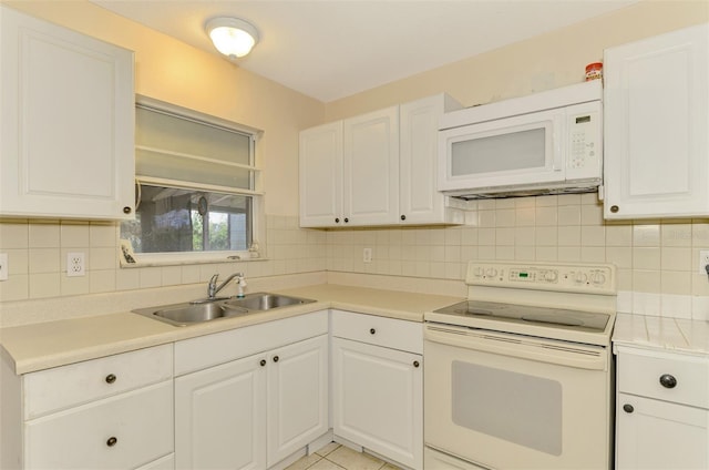 kitchen featuring white cabinets, white appliances, sink, and tasteful backsplash