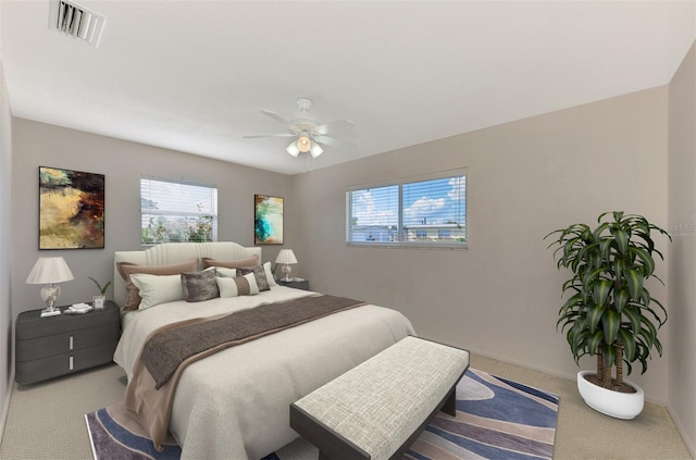 bedroom with ceiling fan and carpet floors