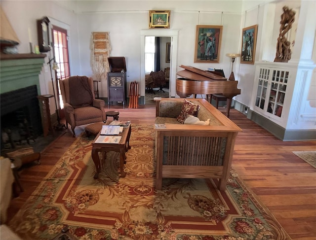 living area with hardwood / wood-style flooring