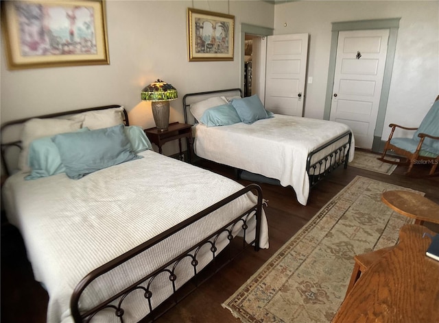 bedroom featuring dark hardwood / wood-style flooring