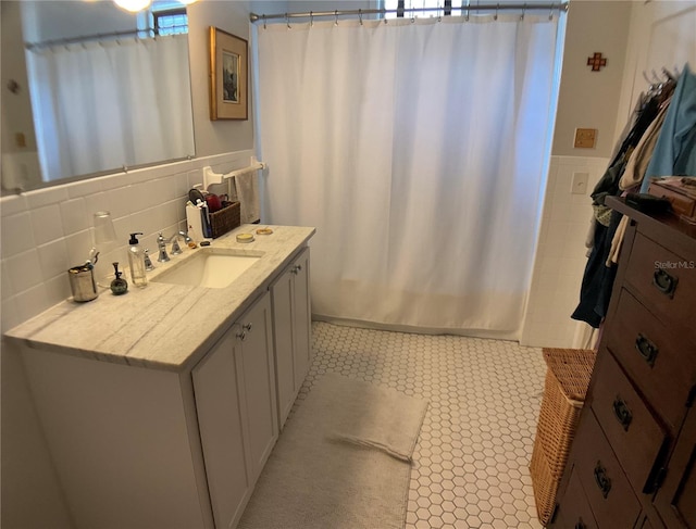 bathroom with decorative backsplash and vanity