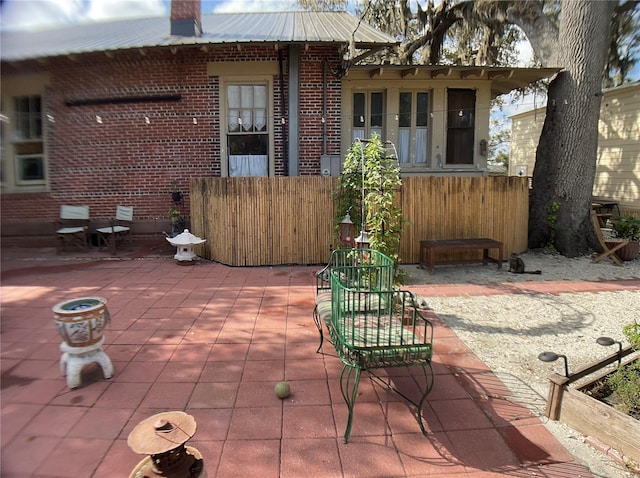 back of property featuring a patio area