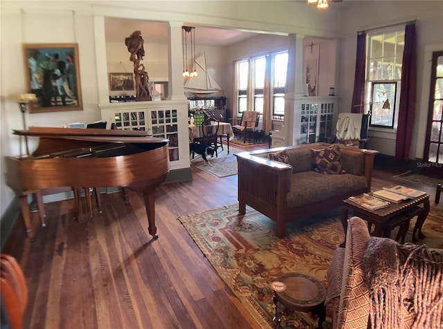 living room with hardwood / wood-style floors and a chandelier