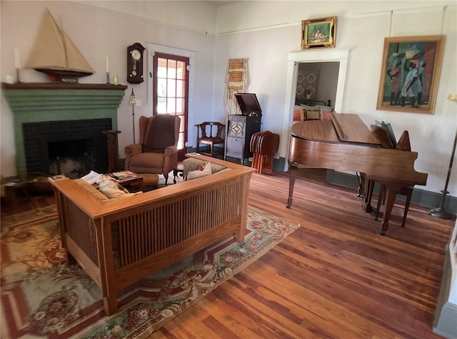 living area with hardwood / wood-style flooring