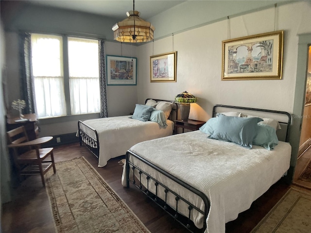 bedroom featuring dark wood-type flooring