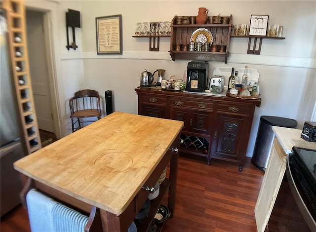 dining space featuring dark wood-type flooring