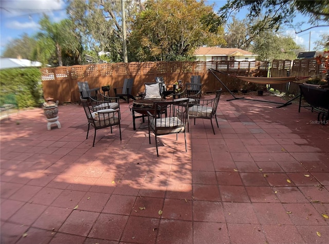 view of patio featuring an outdoor fire pit