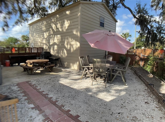 back of house with a patio