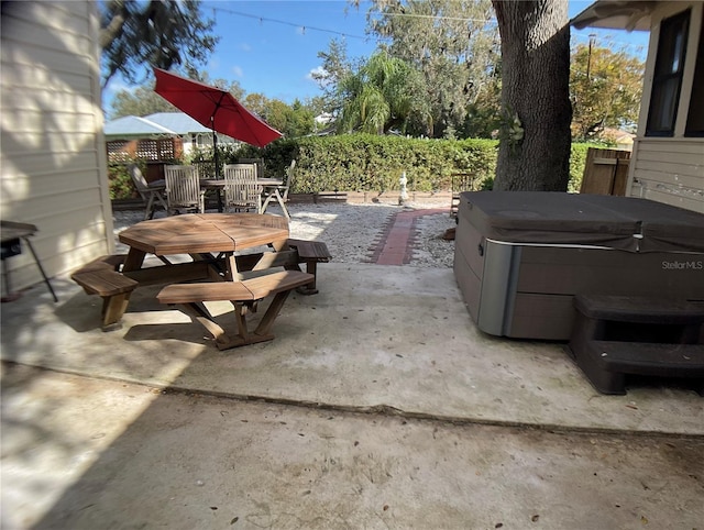 view of patio with a hot tub