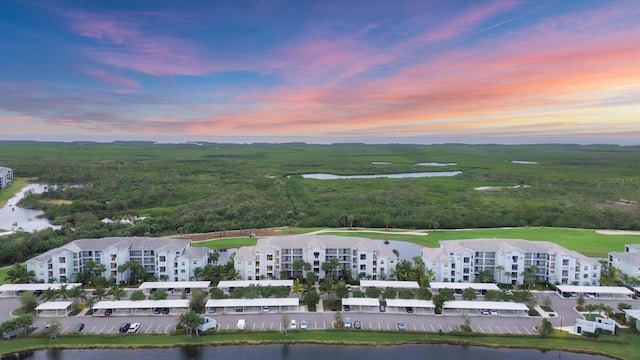 aerial view at dusk with a water view