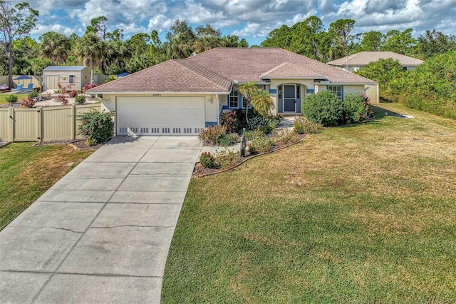 view of front of house with a front lawn and a garage