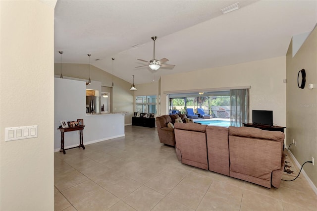 tiled living room featuring vaulted ceiling and ceiling fan