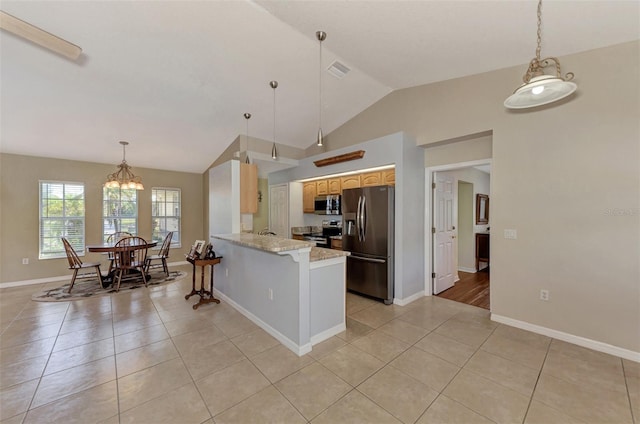 kitchen with lofted ceiling, kitchen peninsula, stainless steel appliances, light tile patterned floors, and light stone counters