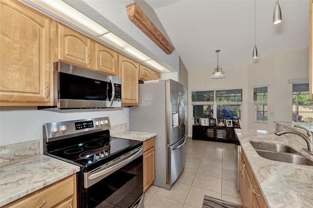 kitchen with light brown cabinets, sink, vaulted ceiling, light tile patterned flooring, and appliances with stainless steel finishes