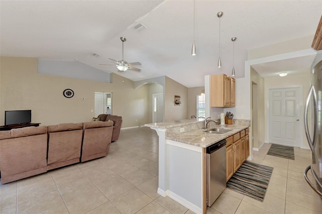 kitchen featuring kitchen peninsula, sink, vaulted ceiling, light brown cabinetry, and appliances with stainless steel finishes