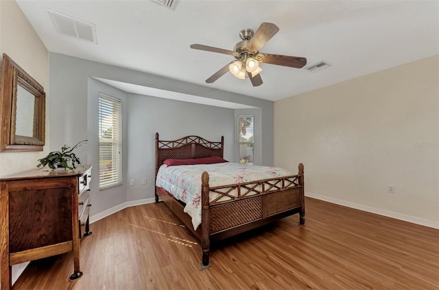 bedroom featuring hardwood / wood-style flooring and ceiling fan