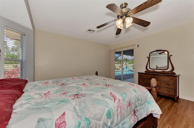 bedroom featuring ceiling fan, hardwood / wood-style flooring, and access to exterior