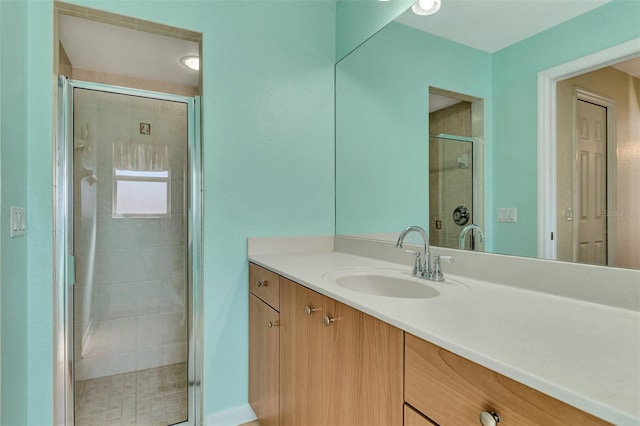 bathroom with vanity and walk in shower