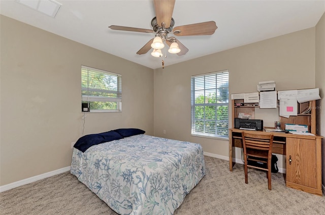 bedroom featuring light carpet and ceiling fan