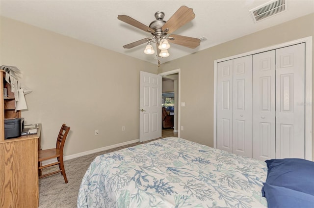 bedroom with light carpet, a closet, and ceiling fan