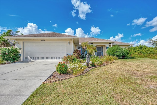 single story home with a front yard and a garage