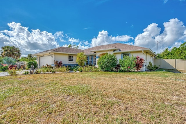 single story home featuring a front lawn and a garage