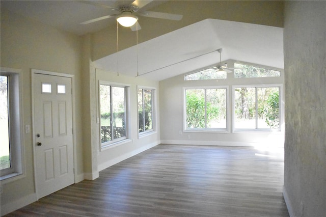 foyer entrance with lofted ceiling, ceiling fan, and dark hardwood / wood-style floors