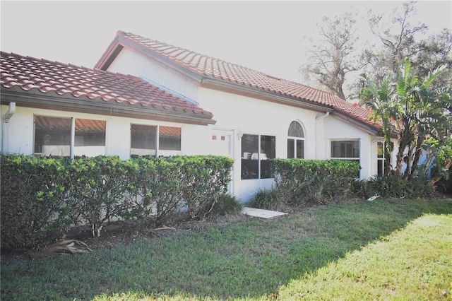 exterior space featuring a front lawn