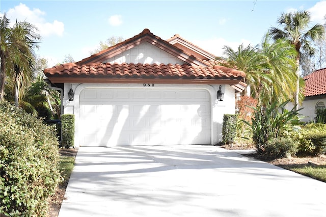 mediterranean / spanish house featuring a garage