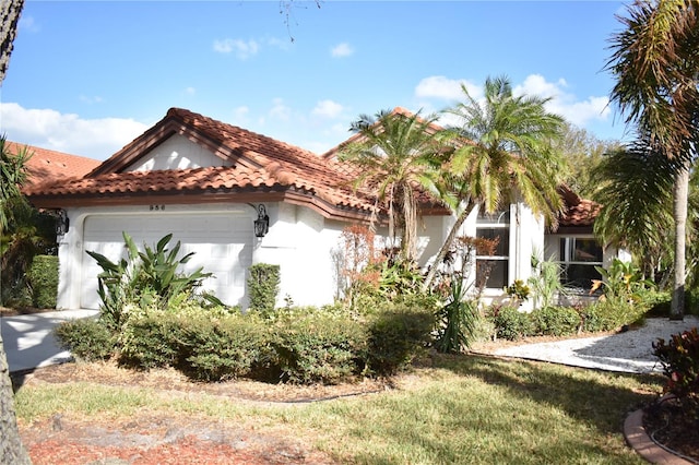 mediterranean / spanish-style home featuring a garage