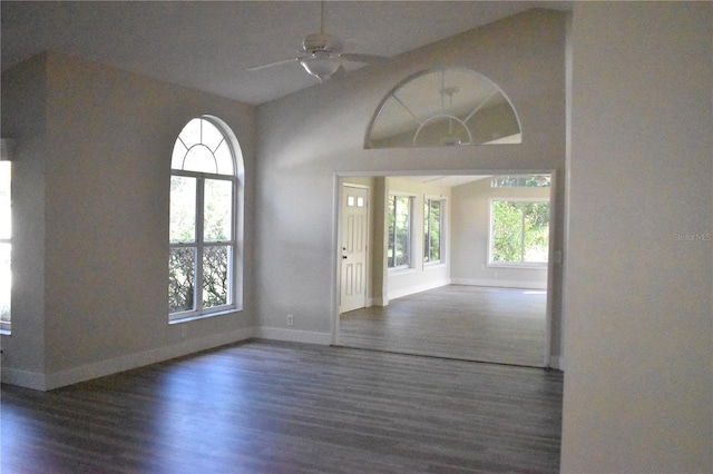 interior space featuring vaulted ceiling, ceiling fan, and dark hardwood / wood-style floors