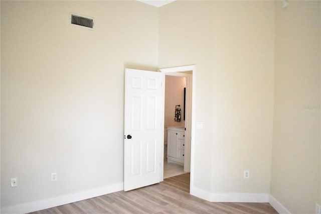 unfurnished room with light wood-type flooring