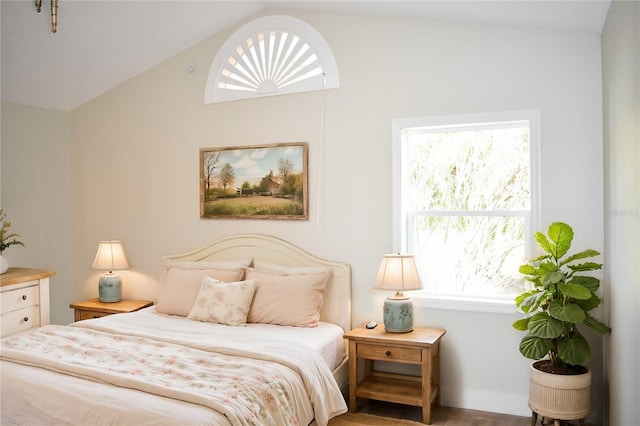 bedroom featuring lofted ceiling