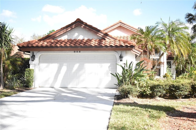 mediterranean / spanish home with a garage