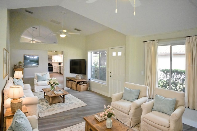 living room with lofted ceiling, hardwood / wood-style floors, and ceiling fan