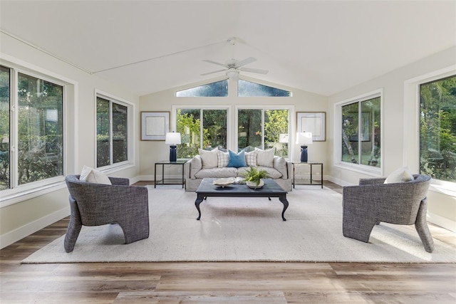956 Harbor Town Dr, Venice, FL 34292 - sunroom featuring plenty of natural light, lofted ceiling, wood finished floors, a deck, and baseboards